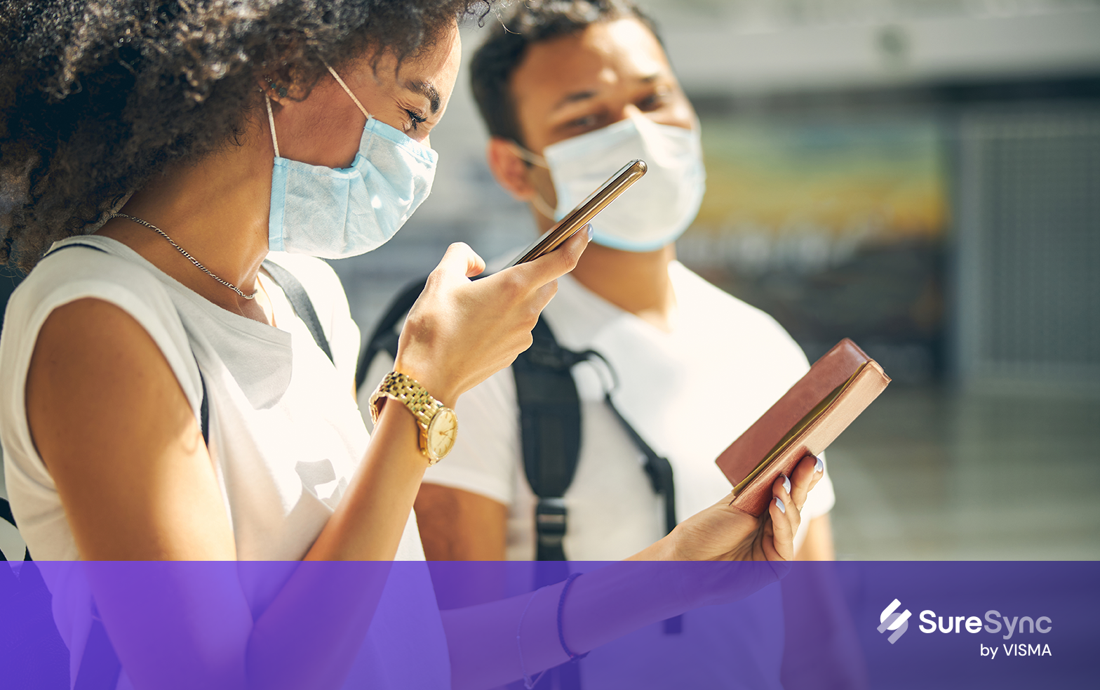 Women during COVID periode wearing masks and checking their telephone