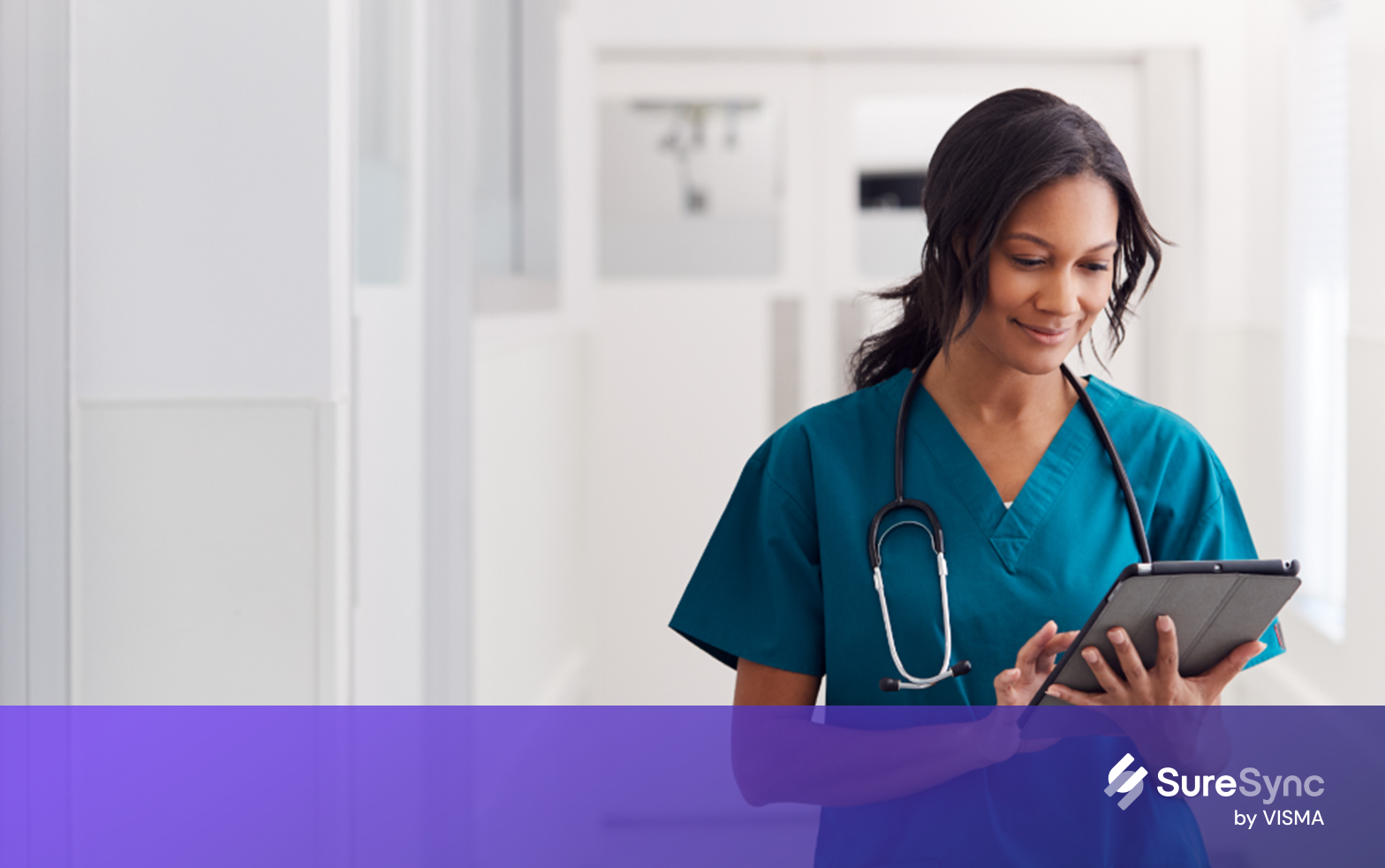 woman checking tablet in hospital