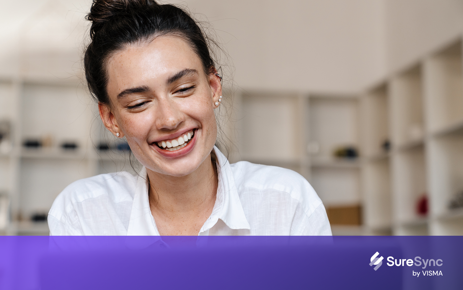 woman smiling at here laptop