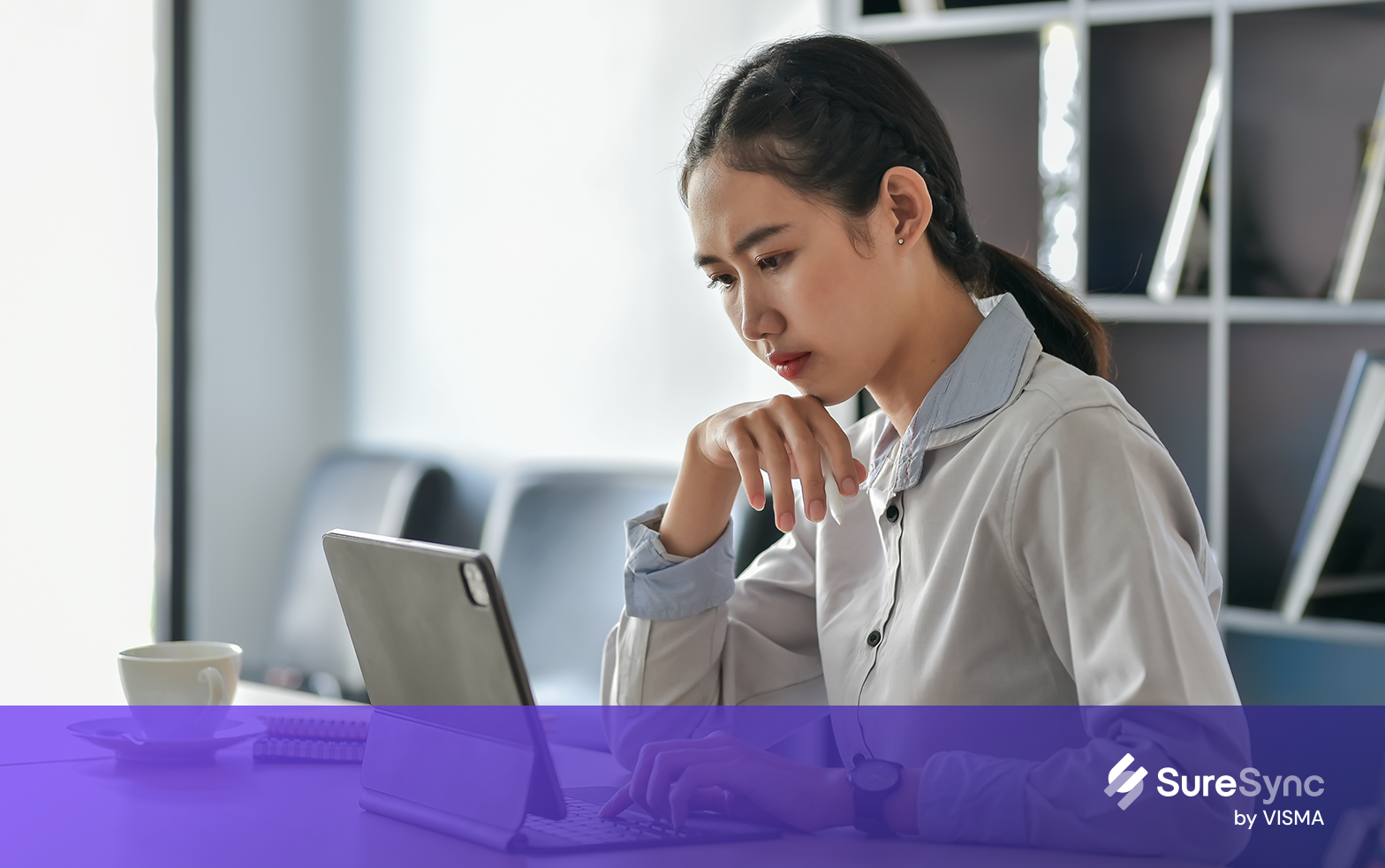 Unhappy woman working from home office with computer being victim of cyber crime